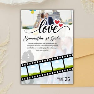 May include: A wedding invitation with the word "love" in cursive script. The invitation features a photo of a couple kissing in front of the Eiffel Tower, with the names "Samantha & John" below. The date "January 25, 2026" is also displayed.