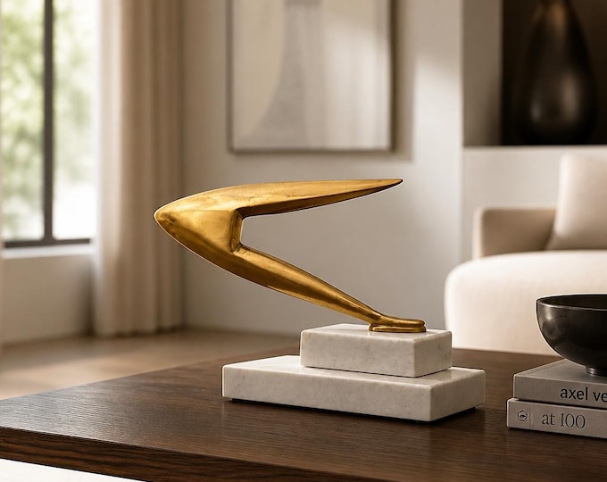 Brass “Speed” statue on stacked marble base