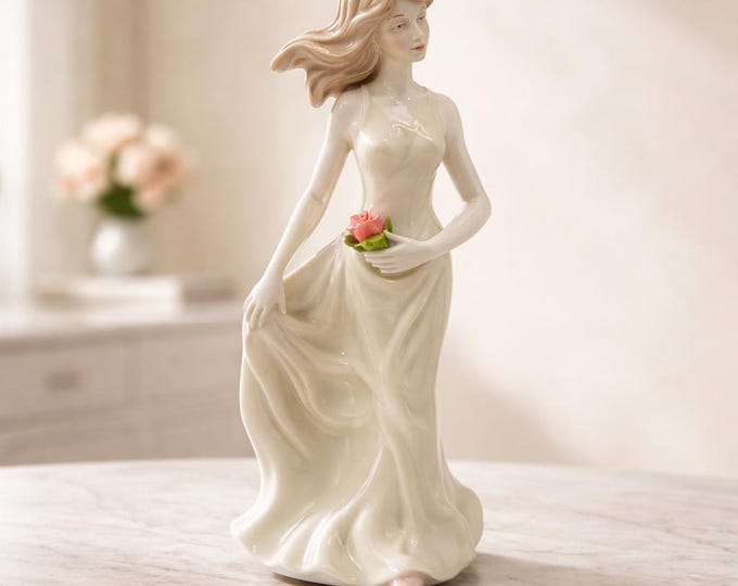 Vintage glazed porcelain woman figurine holding a rose- 8” x 3.5”