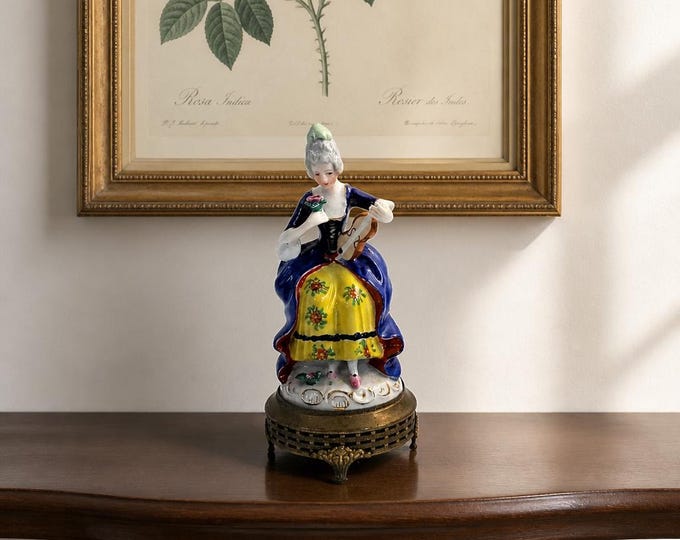 Occupied Japan hand-painted porcelain figurine on metal base