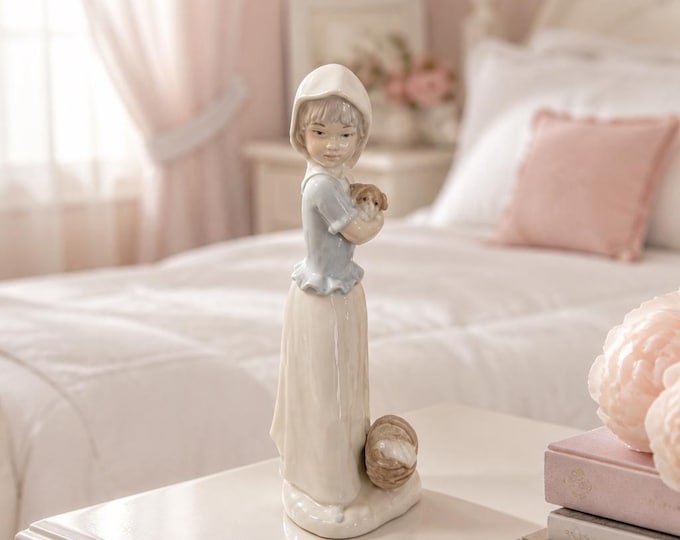 VIntage LLadro figurine- woman holding puppy with picnic basket 9” x 3.5”