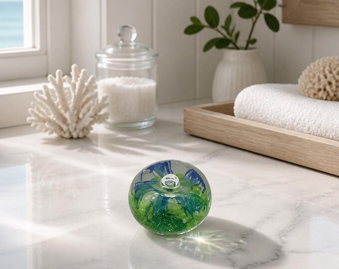 Vintage art glass paperweight with controlled bubble and floral inclusion 3 x 2.5”