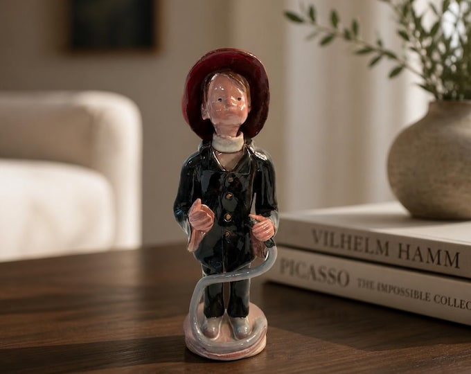 Vintage ceramic glazed pottery boy fireman- 9.5” x 3.5”
