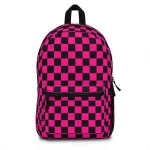 May include: A backpack with a vibrant pink and black checkerboard pattern. The backpack has a black top handle, a front zippered pocket, and a side mesh pocket. The bag is designed for carrying books, supplies, or personal items.