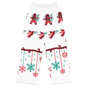 May include: White pajama pants with a repeating pattern of gingerbread men, red birds, snowflakes, and stars. The gingerbread men are wearing red outfits and holding sprigs. The birds are red and carrying sprigs. The snowflakes and stars are red and teal.
