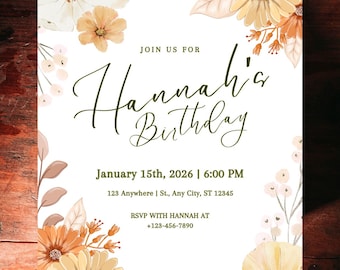 Peut inclure: Une invitation blanche avec des motifs floraux à l'aquarelle dans les tons de jaune, orange et marron. Le texte indique "Rejoignez-nous pour l'anniversaire d'Hannah" avec la date, l'heure et les informations RSVP. La carte est posée sur un fond en bois foncé.