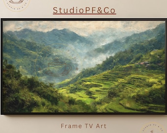 May include: A framed landscape art print depicting a lush, green mountain range with terraced fields. The artwork features a blend of greens, blues, and browns, with the text "Studio PF&Co" and "Frame TV Art".