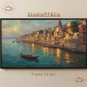 May include: A framed landscape painting depicts a vibrant cityscape along a river, with a boat in the foreground. The artwork features warm, golden hues and cool blues, with the text "Studio PF&Co" and "Frame TV Art".