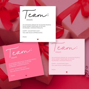 May include: Square cards with the word "Team" and a definition, with a red heart, are displayed. The cards are in white and pink, with a gift box and red ribbon in the background. The text reads "Happy Valentine's Day! You are much appreciated."