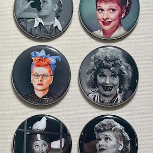 May include: Set of six round pinback buttons featuring images of Lucille Ball in various poses. The buttons showcase black and white and color portraits, including images of her drinking, wearing glasses, and with a dove.