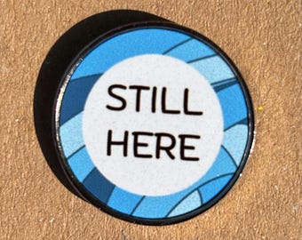 Still Here Pin Badge – Blue Awareness – Stainless Steel – 25 mm
