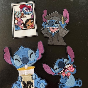May include: Four embroidered patches featuring the character Stitch. One is a rectangular polaroid photo of Stitch and Lilo. Another shows Stitch in a graduation cap and gown. A third shows Stitch drinking boba tea, and the fourth shows Stitch eating a pink doughnut.