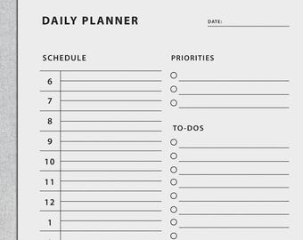 May include: A white daily planner with the text "DAILY PLANNER" at the top. The planner includes sections for schedule, priorities, to-dos, and notes. The schedule section lists times from 6 AM to 3 PM. There is a space to write the date.