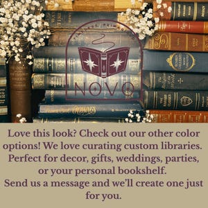 May include: A display of vintage books in different colours and sizes, with the word "NOVO" superimposed. The books are stacked, with white flowers and text at the top and bottom of the image.
