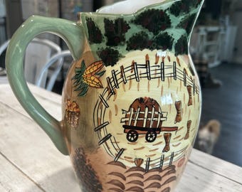 Jarra de estilo rústico. Resistente y bien hecha. Hermosos tonos tierra.