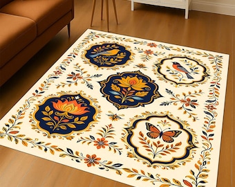 May include: A rectangular area rug with a cream-colored background and a decorative floral and fauna design. The rug features medallions with birds, butterflies, and flowers in shades of blue, orange, and yellow, surrounded by a detailed border.