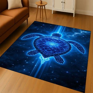 May include: A rectangular area rug featuring a glowing blue sea turtle design against a dark blue background with stars. The turtle has intricate patterns on its shell and is surrounded by light beams, creating a celestial theme.