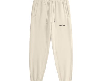 Joggers de polar color crema albaricoque para hombre: pantalones deportivos gruesos y cálidos, cómodos y de corte holgado para el invierno.
