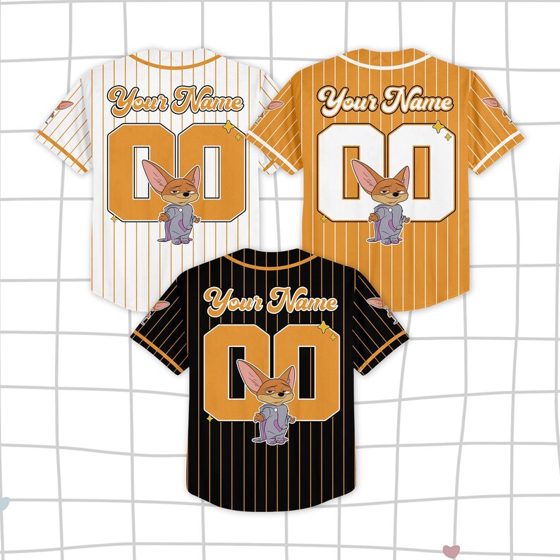 May include: Three baseball jerseys in white, orange, and black, each with a cartoon fox character, the number "00", and the text "Your Name". The jerseys have striped patterns and are displayed on a grid background.