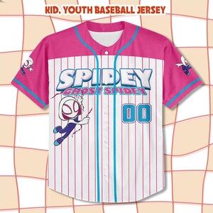 May include: A pink and white baseball jersey with the text "SPIDEY" and "GHOST SPIDEY". The jersey has blue accents and the number "00". A cartoon character is on the front and sleeves. The text "KID, YOUTH BASEBALL JERSEY" is at the top.