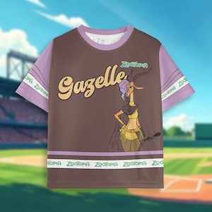 May include: Brown t-shirt with purple sleeves featuring the character Gazelle from Zootopia. The shirt has the word "Gazelle" in a retro font and a graphic of the character. The sleeves have the word "Zootopia" printed on them.