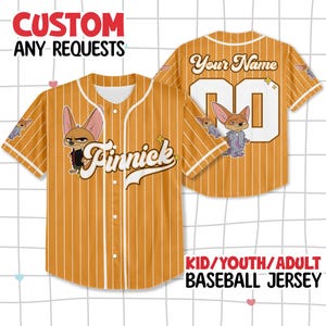 May include: Mustard yellow baseball jersey with white pinstripes, featuring a cartoon fox character and the name "Finnick". The jersey has the text "Your Name" and the number "00" on the back. The text "CUSTOM ANY REQUESTS" is at the top.