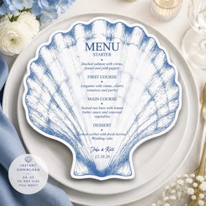 Può includere: Un menu a forma di conchiglia con un disegno a inchiostro blu di un motivo a conchiglia. Il testo recita: MENU, STARTER, Smoked salmon with citrus, fennel and pink pepper, FIRST COURSE, Linguine with clams, cherry tomatoes and parsley, MAIN COURSE, Seared sea bass with lemon butter sauce and seasonal vegetables, DESSERT, Lemon sorbet with fresh berries, Wedding cake, John & Kate, 12.10.26.