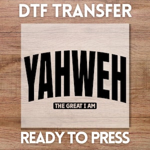 May include: A DTF transfer with the word "YAHWEH" in large, bold, black letters, arched across the center. Below, the text "THE GREAT I AM" is in a smaller, rectangular black box. The words "DTF TRANSFER" and "READY TO PRESS" are above and below.