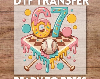 May include: DTF transfer design featuring the number 67 in a donut-style font, a baseball, and two bats. The design includes pink, yellow, blue, and brown colors. The text "READY TO PRESS" is at the bottom.