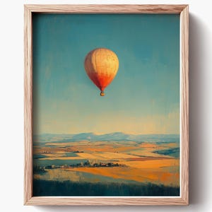 Cuadro vintage de globo aerostático con campos serenos y colores cálidos. Arte mural imprimible con cielo. Descarga digital. 1113