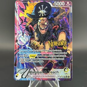 May include: A One Piece trading card featuring Marshall D. Teach with a power level of 5000 and 4 life. The card displays vibrant purple, pink, and yellow artwork, text detailing game mechanics, the word NONSENSE, and a pirate hat icon.