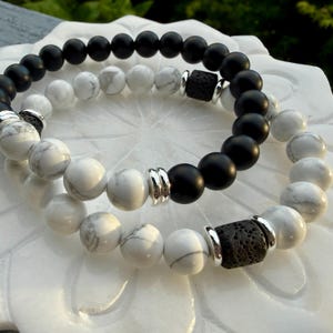 May include: A rectangular wooden sign, distressed for a rustic look, bearing the handwritten text "Welcome to our home". The sign's design is simple and welcoming.