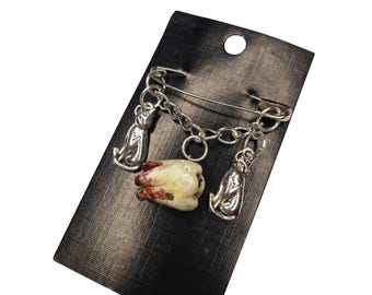Broche de alfinete de segurança em forma de dente