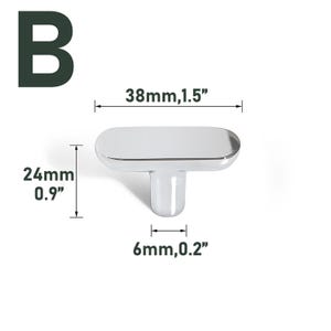 May include: A shiny, silver cabinet knob with a T-shaped stem. The knob is 1.5 inches long, 0.9 inches high, and the stem is 0.2 inches wide. The letter "B" is in the upper left corner.
