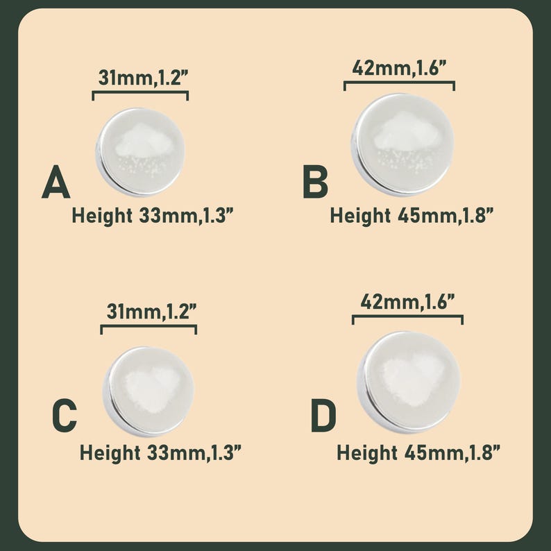 May include: A set of three ceramic mugs with a speckled, cream-colored glaze. Each mug features a different hand-painted design: a blue and green leaf, a yellow flower, and a red berry. The mugs have a simple, modern design.