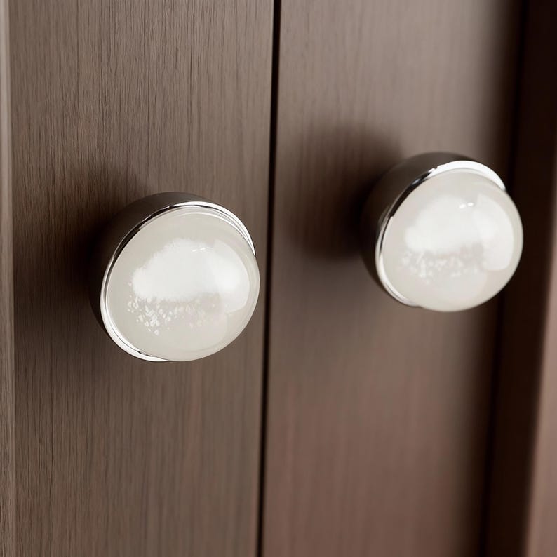 May include: A set of three ceramic mugs with a speckled, matte finish. The mugs are in shades of cream, light gray, and dark gray. Each mug has a simple, minimalist design, perfect for coffee or tea.