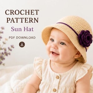 May include: A crochet sun hat with a wide brim, adorned with a dark purple flower and a matching band. The hat is a light beige color. The image also includes the text "CROCHET PATTERN Sun Hat PDF DOWNLOAD".