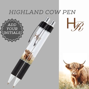 May include: Two clear pens with black grips and silver accents. The pens feature a Highland cow image and the text "Highland Cow Pen." The pens also have the initials "HR" and the text "Add Your Initials."