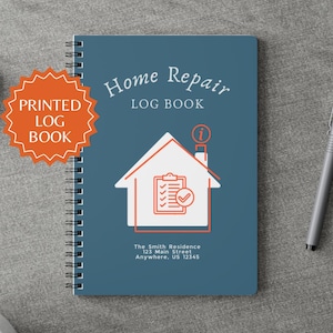 May include: A spiral-bound Home Repair Log Book with a teal cover. The cover features a white house graphic with an orange outline, the text "Home Repair LOG BOOK", and the address "The Smith Residence". An orange sticker reads "PRINTED LOG BOOK".