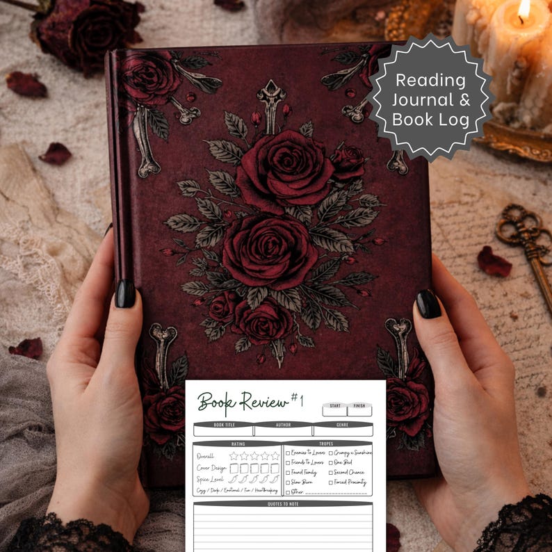 May include: A burgundy journal with a floral rose design and the text "Reading Journal & Book Log." The journal has a matching book review sheet with space for ratings and notes. The cover features a detailed rose and bone design.