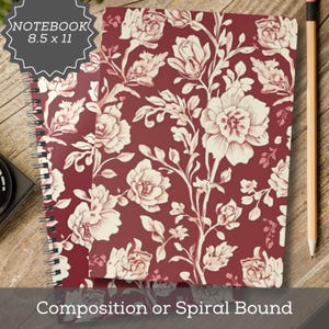 May include: A spiral-bound notebook measuring 8.5 x 11 inches featuring a deep red cover with a repeating cream-colored floral pattern of roses and leaves. The notebook has a black metal spiral binding along the left side and a clean, flat design.