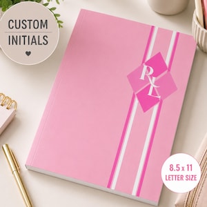 May include: A pink notebook featuring a vertical white and dark pink striped design on the cover. A diamond-shaped graphic in a darker shade of pink displays the white initials RL. The notebook is labeled as 8.5 x 11 inches letter size.