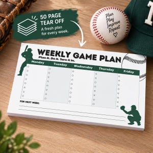 May include: A white weekly game plan notepad with dark green accents, featuring a baseball player silhouette, a baseball graphic, and columns for Monday through Friday with checkboxes. The text reads Weekly Game Plan, Plan it. Do it. Turn it in.