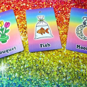 May include: Three colorful cards with illustrations and text. One card shows a bouquet of flowers, another a fish in a bag, and the last a crescent moon. Each card has a rainbow gradient background and a number in the top corner.