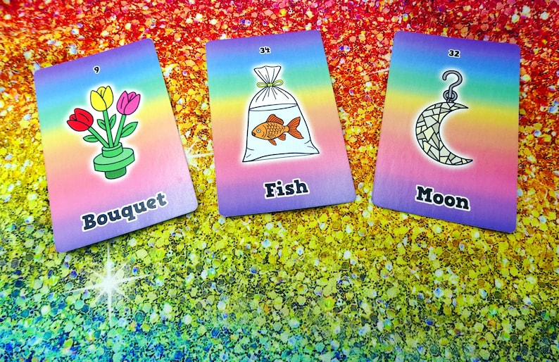 May include: Three colorful cards with illustrations and text. One card shows a bouquet of flowers, another a fish in a bag, and the last a crescent moon. Each card has a rainbow gradient background and a number in the top corner.