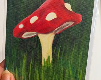 Biglietto di auguri con fungo rosso e natura, biglietto di note vuoto