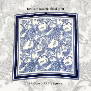 May include: Square scarf with a delicate double-sided print. The scarf features a blue and white paisley design with a navy blue border. The scarf measures approximately 25.6 inches square.