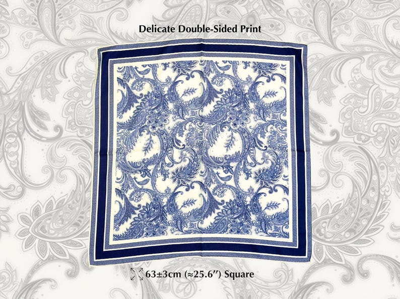 May include: Square scarf with a delicate double-sided print. The scarf features a blue and white paisley design with a navy blue border. The scarf measures approximately 25.6 inches square.