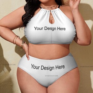 May include: White halter bikini set with high-waisted bottoms. The top features a keyhole design and the text "Your Design Here". The bottoms also display the text "Your Design Here". The bikini is a solid white color.