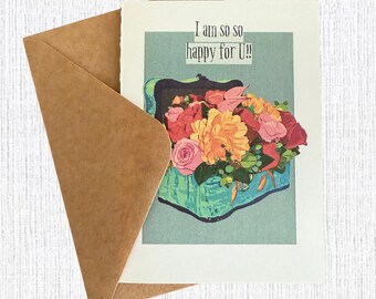May include: Greeting card with a floral arrangement and the text "I am so so happy for U!!" The card features a bouquet of pink, orange, and red flowers in a turquoise container, with a brown envelope.